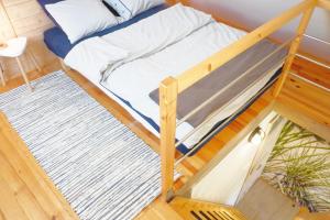 Postel nebo postele na pokoji v ubytování Domek Drewniany