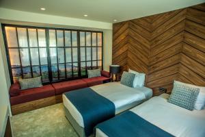 Voodi või voodid majutusasutuse Hotel Hedonic toas