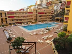 a view of a swimming pool in a building at Olivia Sunset Playa in Puerto de Santiago