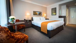 Uma cama ou camas num quarto em Hotel Kilmore