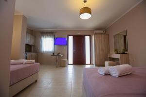 A bed or beds in a room at Petani Resort