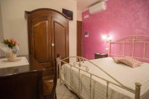 Postel nebo postele na pokoji v ubytování B&B Le due gioie