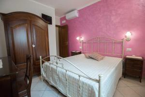 Postel nebo postele na pokoji v ubytování B&B Le due gioie