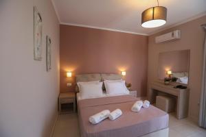 A bed or beds in a room at Petani Resort