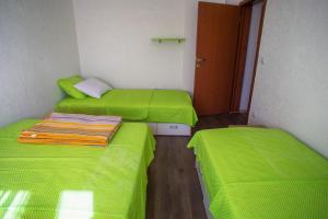 Postelja oz. postelje v sobi nastanitve Apartmani Restoran Durmitor
