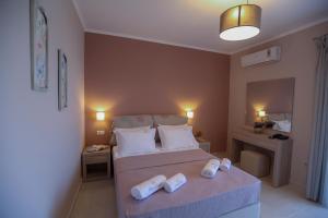 A bed or beds in a room at Petani Resort