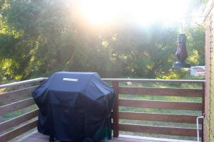 a tent sitting on top of a wooden fence at Little Red Caboose in Oakhurst