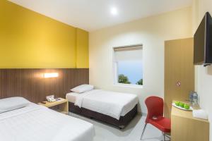 TV in/ali zabaviščno središče v nastanitvi Astera Hotel Bintaro