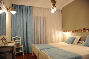 Posteľ alebo postele v izbe v ubytovaní Evangelia Rooms & Αpartments - B