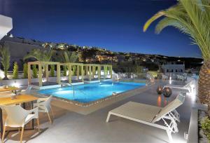 a swimming pool on top of a building at Callia Retreat Suites - Adults Only in Fira