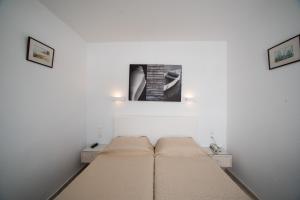 Postel nebo postele na pokoji v ubytování Hotel Spanelis