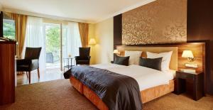 Postel nebo postele na pokoji v ubytování Hotel Erasmus - Mein Genuss- und Wellnesshotel