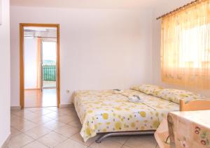 Postel nebo postele na pokoji v ubytování Apartments Cvita Sučić