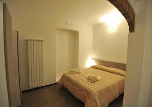 a bedroom with a bed with two towels on it at La casa di Michela in Termoli +8 photos