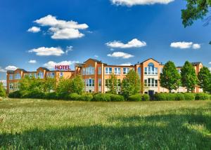 a rendering of a hotel with a grass field at Grunau Hotel in Bayreuth