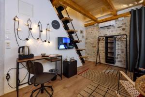 a room with a desk and a chair at Apartments & Rooms Tiramola - Old Town in Trogir