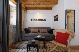 a living room with a couch and a table at Apartments & Rooms Tiramola - Old Town in Trogir