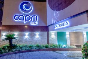 a building with a sign for a hotel at Capri Hotel in Duque de Caxias