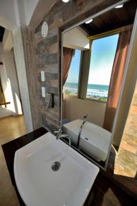 Koupelna v ubytování Hotel La Barca