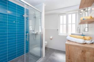 a bathroom with a glass shower and a toilet at Villa Riva in Jelsa +37 photos