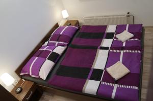 Postel nebo postele na pokoji v ubytování Penzion Kutil Trojanovice