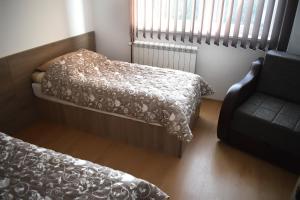 سرير أو أسرّة في غرفة في Vila Premijer Divčibare