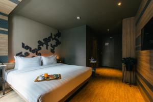 Voodi või voodid majutusasutuse NAP Hotel Bangkok toas