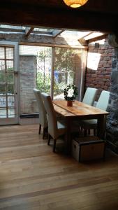 a wooden table and chairs in a room at Historic Hideaway in Cork City Centre in Cork +17 photos