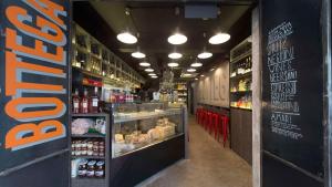 a grocery store aisle with drinks and food on display at River City Inn in Singapore