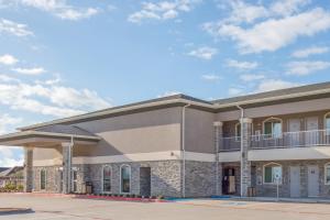 a rendering of the front of a building at Days Inn by Wyndham Bryan in Bryan