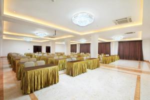 a banquet hall with chairs and tables in a room at Grand Palace Hotel Sanur - Bali in Sanur