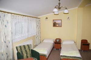 Postel nebo postele na pokoji v ubytování Gościniec Pan Tadeusz