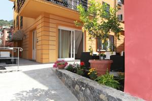 a building with flowers and plants in front of it at Hotel Margherita in Monterosso al Mare