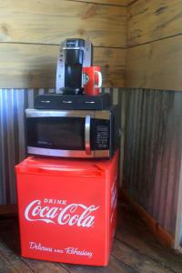 a cocacola microwave sitting on top of a red box at Hawk's Rest in Oakhurst