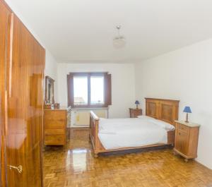 Albergo Diffuso Balcone sul Friuliにあるベッド
