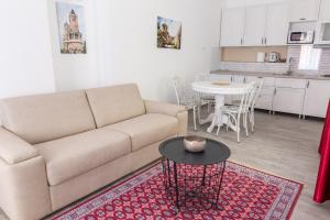 a living room with a couch and a table at Apartment Savamala 59 in Belgrade