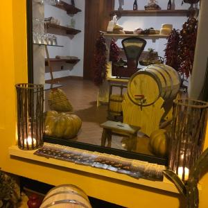 a store with pumpkins and a mirror on a shelf at Le Piccole Grotte in Scilla