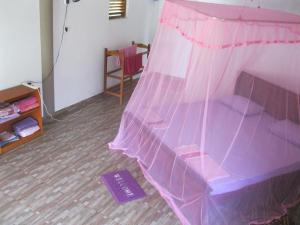 Postel nebo postele na pokoji v ubytování Sunshine Cafe