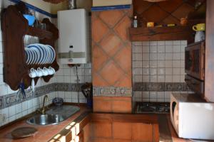 a kitchen with a sink and a counter top at La Orospeda in Cazorla