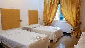 Ένα ή περισσότερα κρεβάτια σε δωμάτιο στο Fornaro Apartments