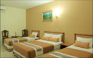 Postel nebo postele na pokoji v ubytování Hotel Mataram 2 Malioboro