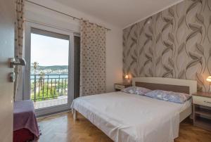 Postel nebo postele na pokoji v ubytování Villa Marija