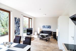 a living room with a couch and a table at Gipfelstürmer in Winterberg