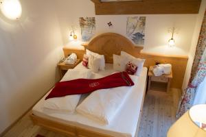 Ένα ή περισσότερα κρεβάτια σε δωμάτιο στο Hotel Gianna