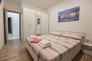 En eller flere senge i et værelse på Apartment Dalmatia