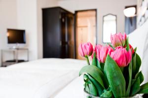 Postel nebo postele na pokoji v ubytování Hotel Metropol