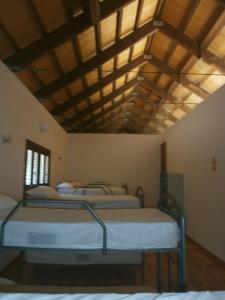 Giường trong phòng chung tại Albergue Coto Real de la Marina