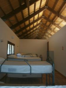 Postel nebo postele na pokoji v ubytování Albergue Coto Real de la Marina
