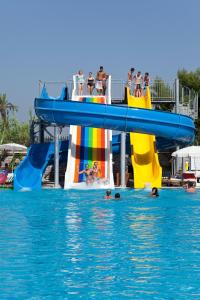 a group of people in the water on a water slide at Side Lilyum Hotel & Spa in Side