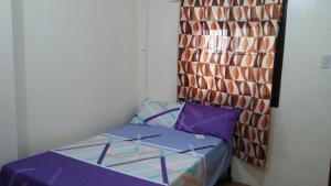 Letto o letti in una camera di Budget Studio Unit in Makati